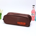 Waterproof brown travel shoe storage bag with printed icons and a zipper closure - Coffee