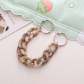 Detail view of brown and beige marble texture acrylic chain with silver metal ring buckles - Beige Marble Acrylic Chain
