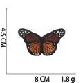 Detail view of a 8x4.5cm orange and black butterfly embroidery patch with dimensions - No.14 Orange Butterfly