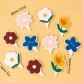 Kleurrijke bloemen taarttoppers voor kinderfeestjes in vijf verschillende heldere kleuren - Kleine Bloemen 100 Stuks