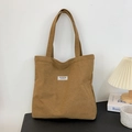 Brown corduroy tote bag with dual shoulder straps and a white label for daily use - Coffee