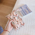 Close-up of floral mini cotton handbag pouch with handle being held in hand - Red Tulip