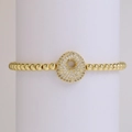 Golden stretch bead bracelet with sparkling zircon pavé round charm on jewelry display - Letter O