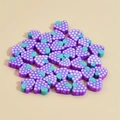 Detailed pile of 10mm heart-shaped purple grape polymer clay beads for DIY jewelry - Purple Grape