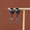 Detail of black cross drop earrings in matte stainless steel on a golden display stand - Black (C-1)