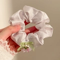 Detail of floral scrunchie with light green ribbon bow and purple flower pendant charms - Light Purple Print