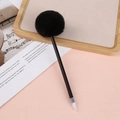 Detail shot of a creative black ballpoint pen with a soft decorative faux fur pom pom top - 0.5mm / Black