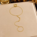 Gold slave bracelet with star charms and zircon accents on a textured background - Stars and Zirconia Style (B2062)