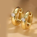 Close-up of gold-plated heart huggie earrings with clear cubic zirconia heart crystals - Heart White Zircon Gold