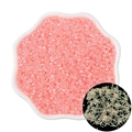 Luminous glass seed beads for DIY jewelry in pink and gold tones displayed in a petal dish - Red