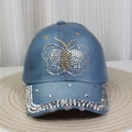 Détail d'une casquette de baseball en jean bleu avec motif papillon en strass et rivets - No.29-Papillon Délavé-Bleu