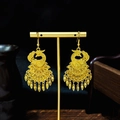 Golden phoenix totem earrings in ethnic style with filigree patterns on display stand - Gold Hollow Tassel Phoenix