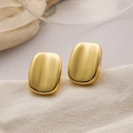 Polished 18K gold-plated square hoop earrings with rounded corners on white fabric - Smooth Square Studs