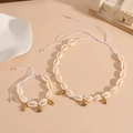 Detail of handmade seashell necklace and bracelet set with golden starfish pendants - White Rope Shell Set