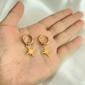 Detail of 18K gold-plated stainless steel hoop earrings with star pendants held in hand - Octagram Shape (DE065)