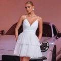 Detail of white lace bodice and tiered mesh skirt on a mini evening dress for women - XS / White