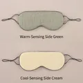 Close-up of double-sided sleep mask with warm green mesh and cool beige silk surfaces - Double-sided Warm/Cool / Matcha Green/Beige