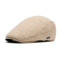 Classic beige newsboy cap for men featuring a textured tweed finish and metal brand tag - Adjustable / Beige