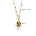Detail of 14K gold plated necklace with starburst engraved oval lava pendant and green zircon - Irregular Oval