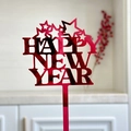 Macro detail of red acrylic Happy New Year cake topper with marbled texture - Mirror Red 2026 Style G