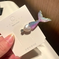 Detail view of a laser purple mermaid tail hair clip with heart pearl decoration - 3# Heart Mermaid Tail - Purple