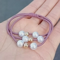 Elastic purple hair ties set with three strands featuring white pearls and gold beads - Three-Piece Set / Korean Pink