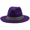 Detail of purple wool fedora hat featuring a stylish black and white striped ribbon band - Deep purple