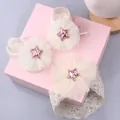 Detail of infant gift set featuring lace headband and knit socks with glitter star tulle - Style 12 (White Pink Star/White Pink Star)