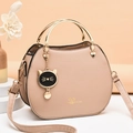 Beige shell crossbody bag with golden ring handles and a cute cat charm detail - Khaki