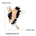 Broche papillon en émail rose et noir avec strass et détails de dimensions - Noir