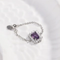 Detail view of purple rectangle gemstone ring with adjustable silver chain and heart charm - Purple Zirconia - Silver