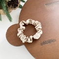 Elegant champagne satin scrunchie displayed on a cute bear-shaped wooden stand - Small / Champagne