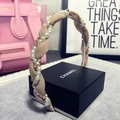 Pink woven headband with faux pearls and sparkling crystal accents on a black box - g-097 Beige