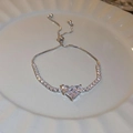 Detail of silver heart zircon bracelet with adjustable sliding clasp on white plate - Bracelet-Silver Heart