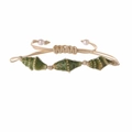 Detail of adjustable woven shell bracelet with olive green ceramic beads and white pearls - Spotted Green