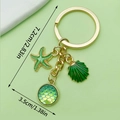 Grüner Seestern und Muschel Schlüsselanhänger mit Goldfinish, Maße 7,2cm Gesamtlänge - LS168 Grün Fischschuppen Muschel
