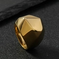 Polished geometric gold stainless steel wide ring with faceted surface on black rock - US 7 / Multi-faceted / Gold