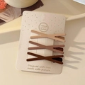 Set of four matte earth-toned hair clips including beige and chocolate brown finishes - Coffee Gradient Cross Set