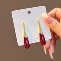 Close-up of teardrop burgundy beads and golden metal dangles on display card - E185-3/Burgundy Drop Silver Pin