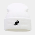 Close-up of white ribbed knit beanie with black ghost embroidery on the folded cuff - White