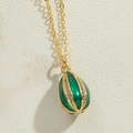 Golden pendant necklace with egg-shaped dark green enamel and small white zircons - Green