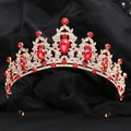Detailed macro view of golden crown with red teardrop crystals and clear rhinestones - KC Gold White Diamond + Large Red Diamond