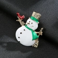 Christmas snowman brooch pin with green hat and red bird on black leather background - Gold Christmas Snowman