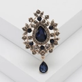Baroque style brooch with dark blue teardrop stones and crystals on white blocks - Blue