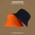 Detail of orange and navy cotton sun hats with wide brims for UV protection - M (56-58cm) / Orange & Black