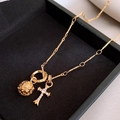 Golden double pendant necklace featuring a hollow metal ball and a zircon cross charm - Hollow Sphere Zirconia Cross Double Pendant / Gold