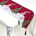 Close-up of Christmas table runner with festive embroidery and red pom-pom tassels - Red Snowman Style