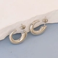 Polished silver irregular C-shaped stainless steel earrings on a decorative stone base - Silver Style K7-27