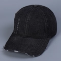Close-up of black denim baseball cap with vintage distressed ripped details and texture - M (56-58cm) / Black