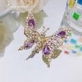 Golden butterfly hair clip with purple crystals and sparkling rhinestones on mirror - Teardrop Crystal Butterfly / Purple